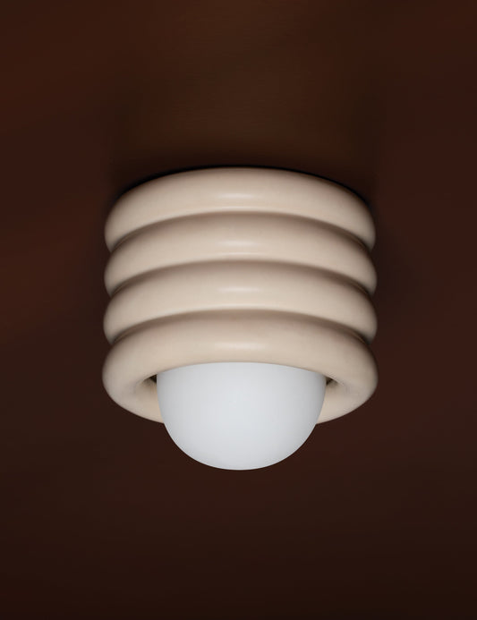 Bibi Flush Mount Light styled in a room