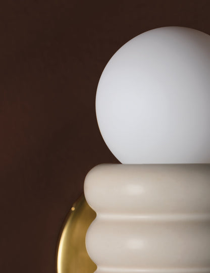 Bibi Sconce styled in a room