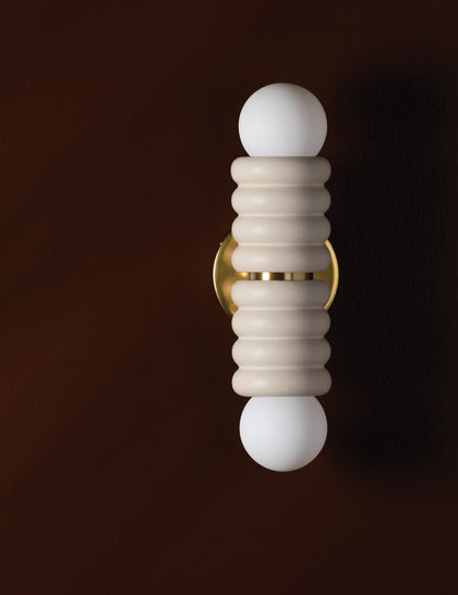 Bibi Sconce styled in a room