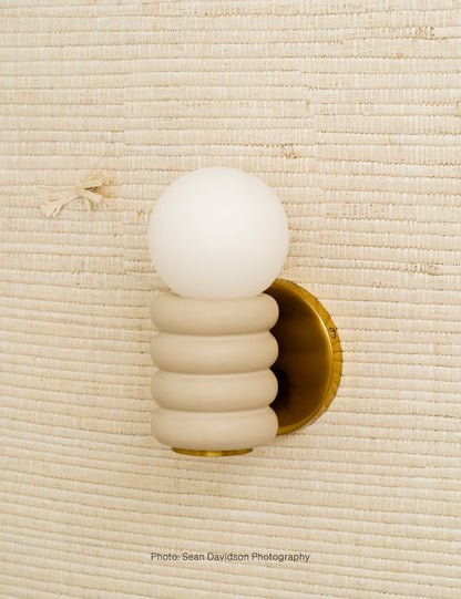 Bibi Sconce styled in a room
