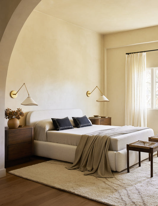 Arroyo Adjustable Sconce bedroom wall light in a styled room