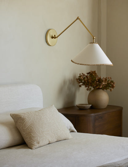 Arroyo Adjustable Sconce styled in a room