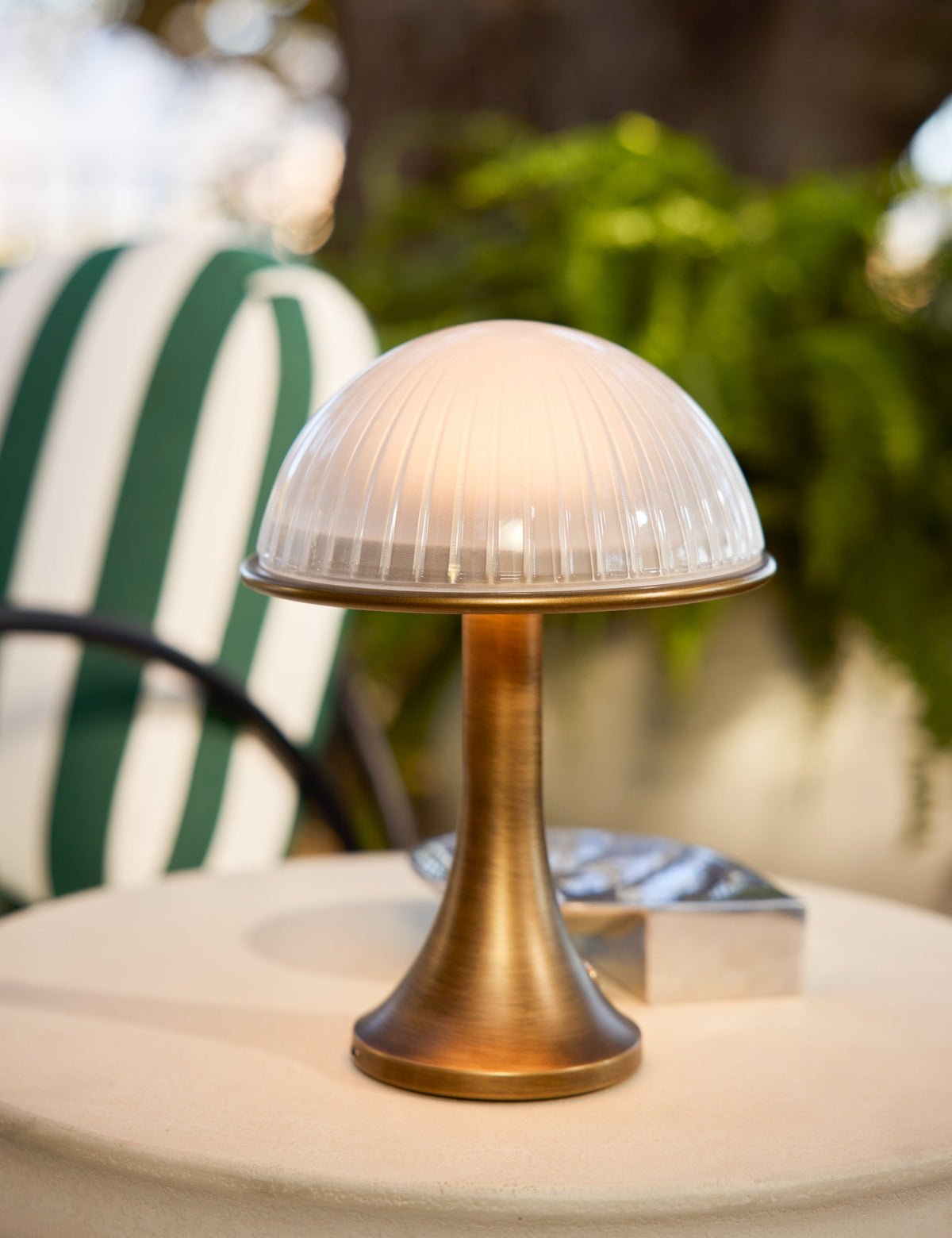 Chamblin Outdoor Cordless Table Lamp cordless lamp in a styled room