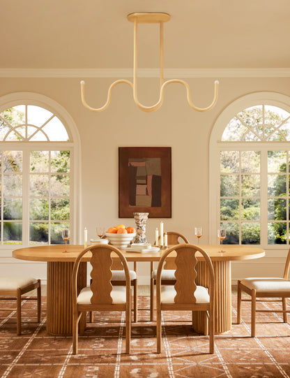 Noor Linear Chandelier dining room light in a styled room