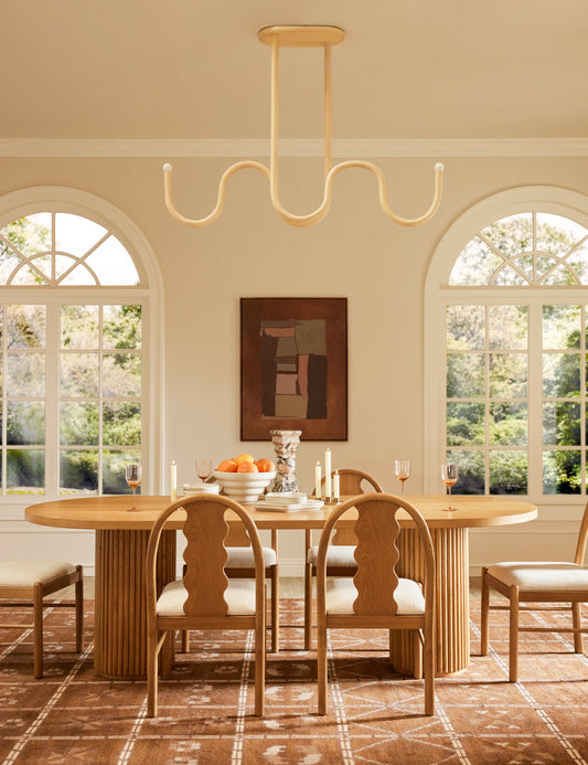 Noor Linear Chandelier dining room light in a styled room