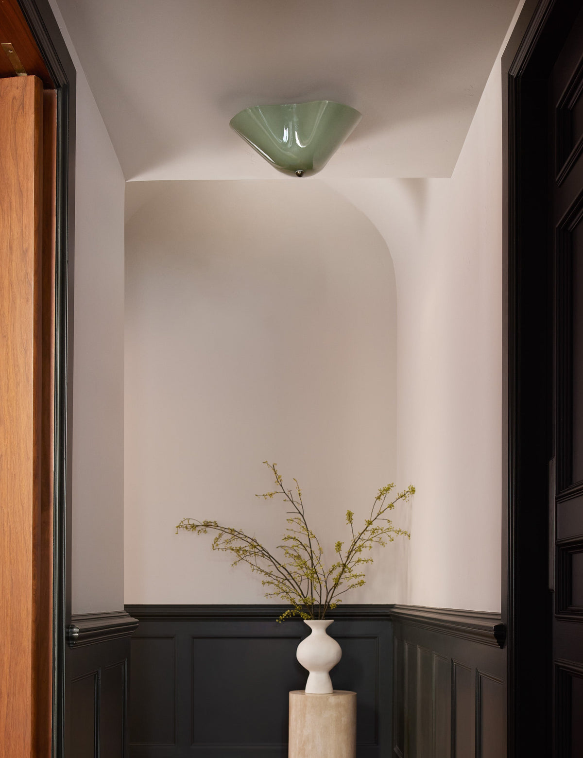 Radner Flush Mount Light styled in a room