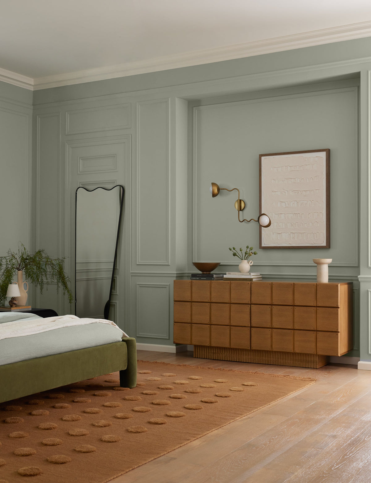 Kukka Adjustable Sconce bedroom wall light in a styled room