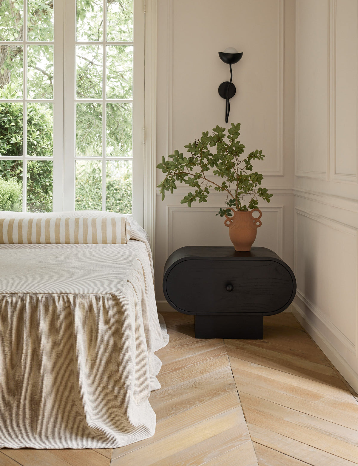 Kukka Sconce styled in a room