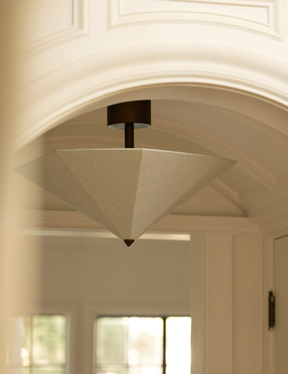 Claude Flush Mount Light ceiling light in a styled room