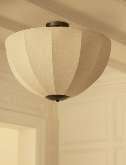 Sello Flush Mount Light styled in a room