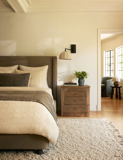 Sello Swing Arm Sconce styled in a room