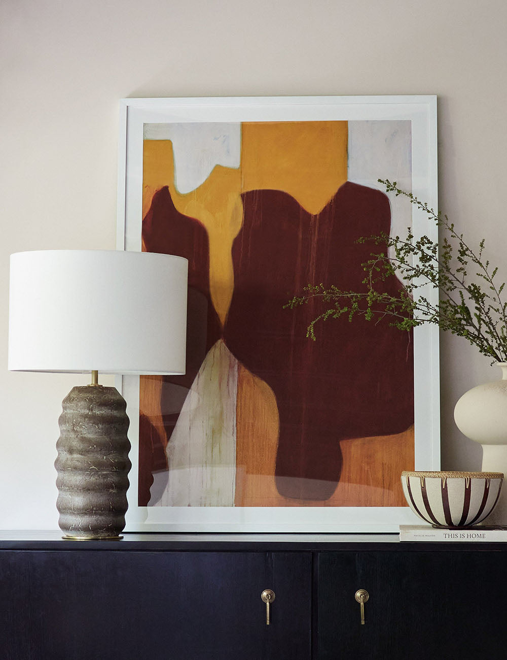 Ola Ceramic Table Lamp styled in a room